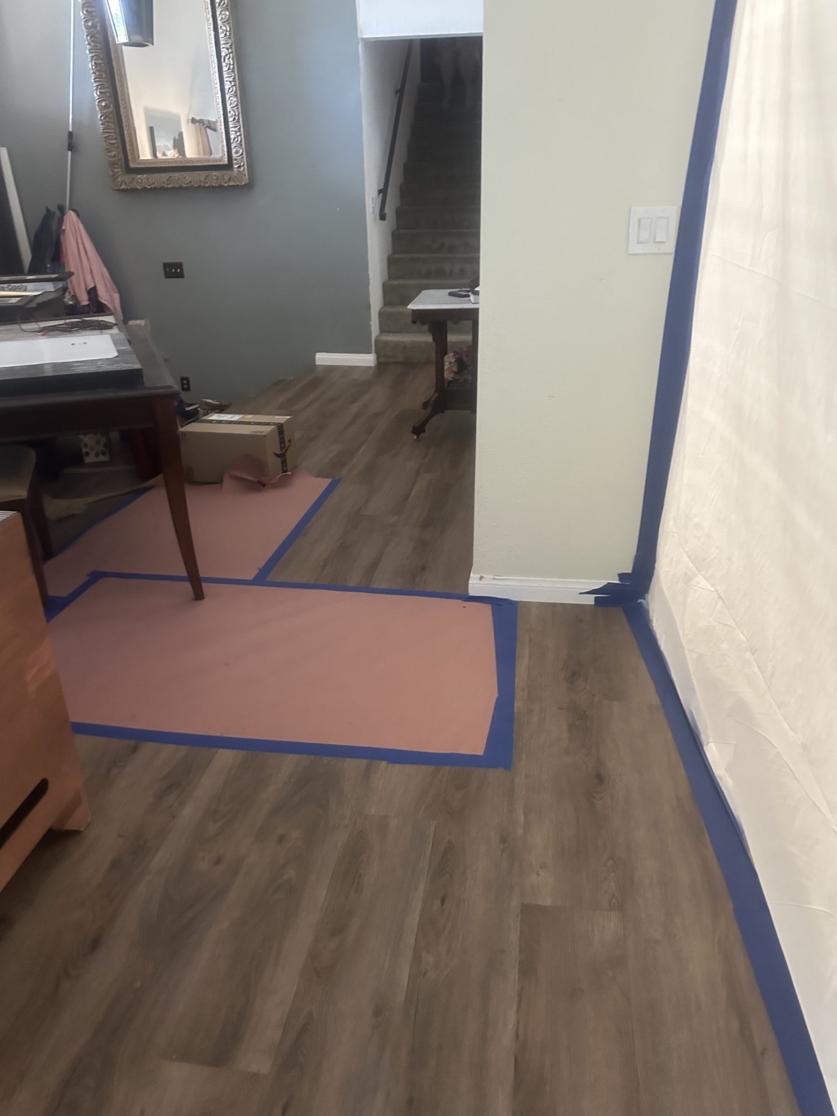 Floor protection and a taped plastic barrier set up before repair work – 77 Rapid Restore
